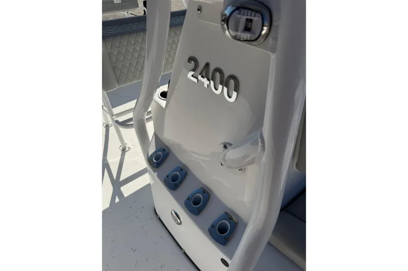 Slide: The Image of 2026 Blazer Bay 2400 boat console with rod holders and sleek design. - 31