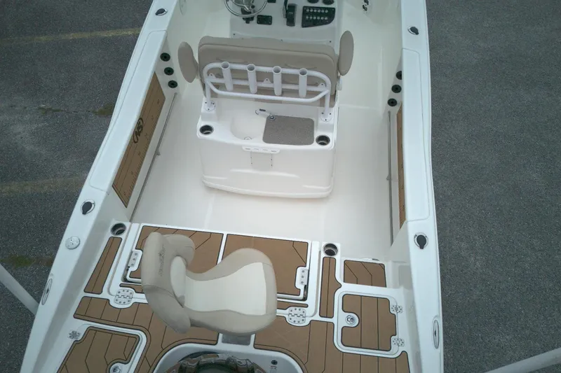Slide: The Image of 2022 NauticStar 251 Hybrid boat interior with seating and deck details. - 11