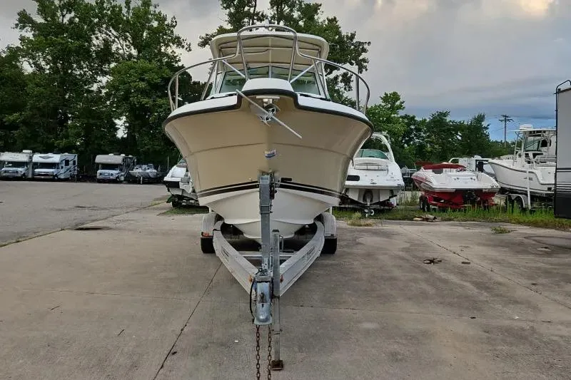 Slide: The Image of 2001 Pursuit 2870 Walkaround boat on trailer in outdoor storage area. - 4