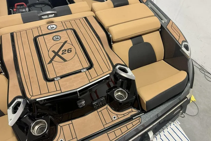 Slide: The Image of 2021 MasterCraft X26 boat dashboard with steering wheel and digital controls. - 6