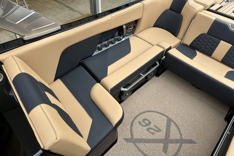 Slide: The Image of Luxurious interior of 2021 MasterCraft X26 boat with beige and black seating. - 9