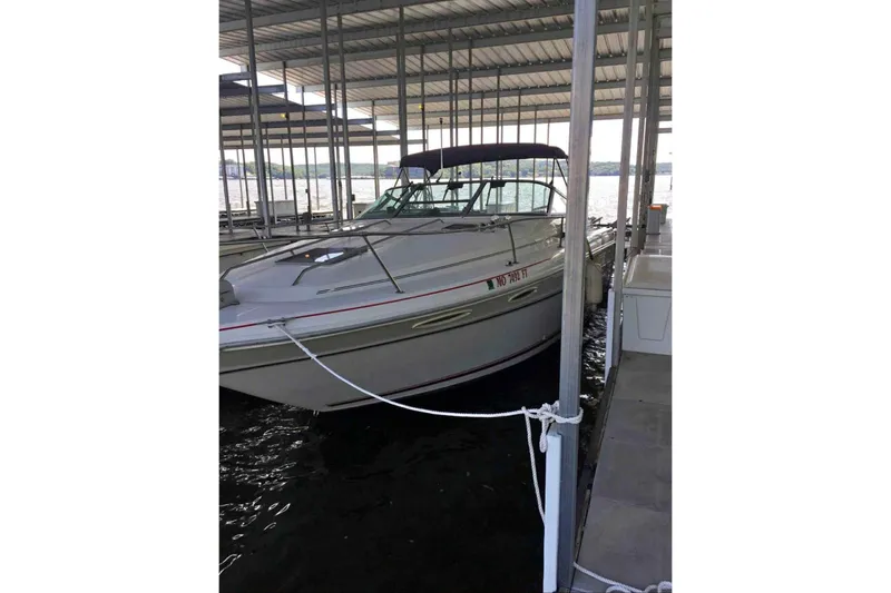 Slide: The Image of 1992 Sea Ray 300 Weekender docked in a covered marina slip. - 7