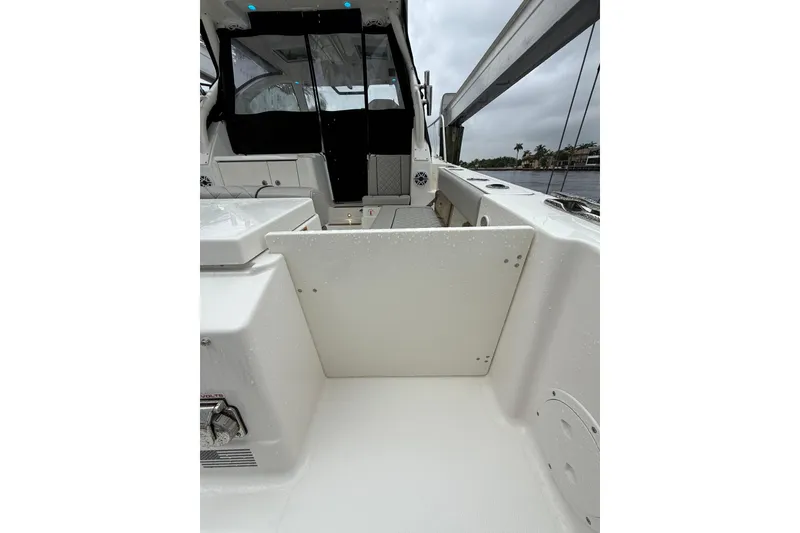 Slide: The Image of 2025 Pursuit OS 325 Offshore boat interior with sleek white design and modern features. - 12