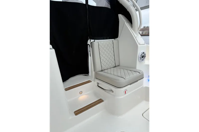 Slide: The Image of 2025 Pursuit OS 325 Offshore boat interior with cushioned seating and elegant design. - 27
