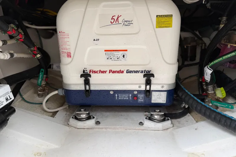 Slide: The Image of Fischer Panda generator in 2025 Pursuit OS 325 Offshore boat engine room. - 76
