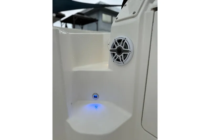 Slide: The Image of 2025 Pursuit OS 325 Offshore boat interior with speaker and blue LED light. - 84