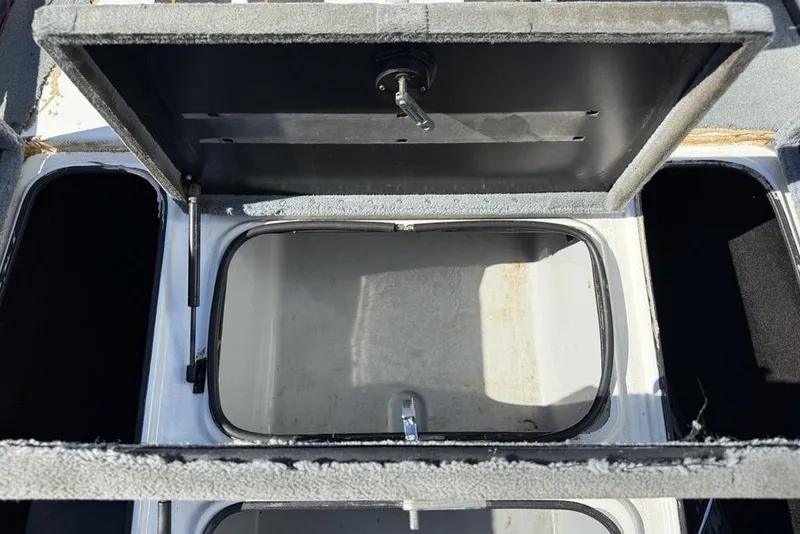 Slide: The Image of 2005 Triton TR-21 boat dashboard with Garmin and Humminbird fish finders. - 10