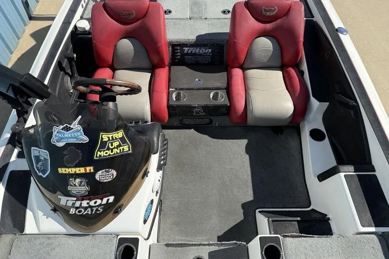 Slide: The Image of Dashboard of a 2005 Triton TR-21 boat with control switches and Garmin display. - 15