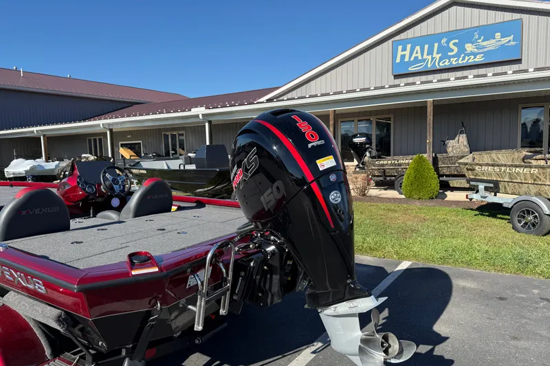Slide: The Image of 2026 Vexus AVX1980 boat with powerful outboard motor at Hall's Marine dealership. - 2