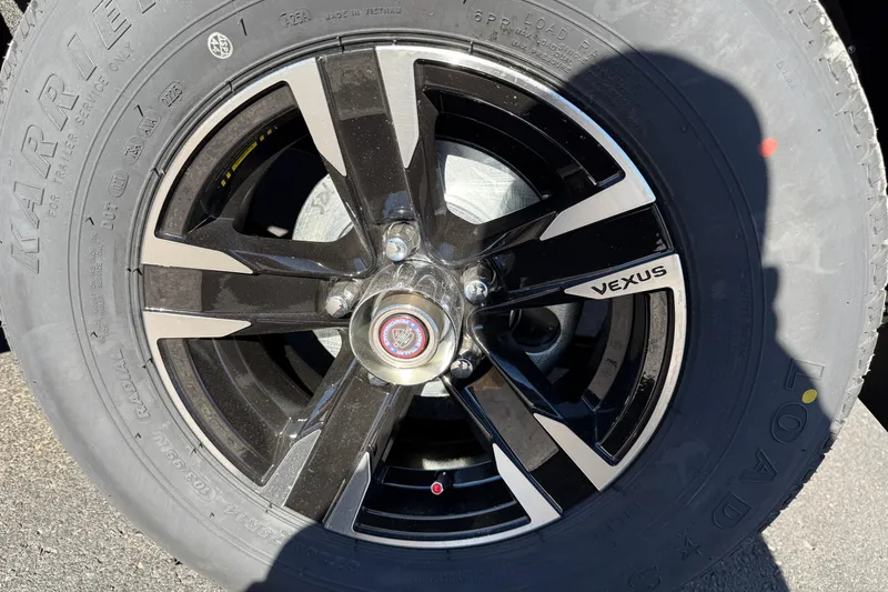 Slide: The Image of 2026 Vexus AVX1980 wheel with black and silver alloy rim design. - 5