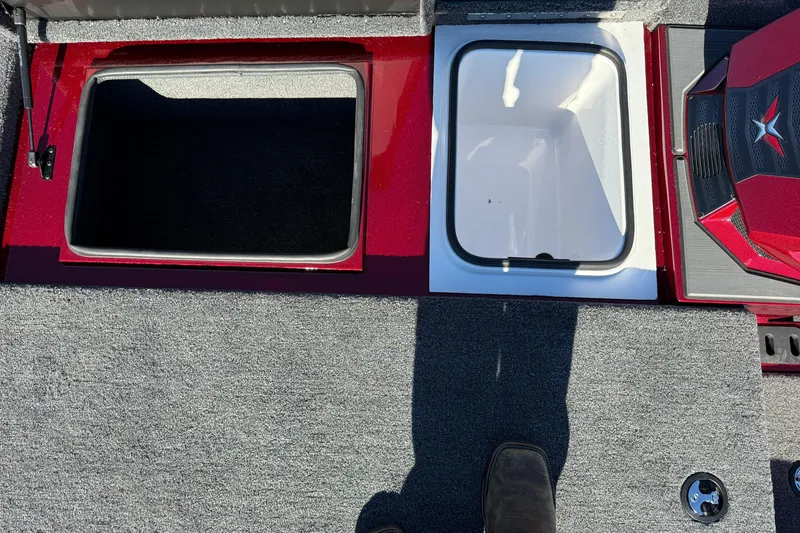 Slide: The Image of 2026 Vexus AVX1980 boat interior with open storage compartments and carpeted flooring. - 8