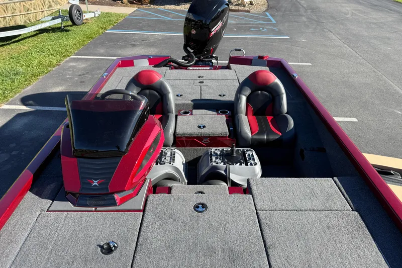 Slide: The Image of 2026 Vexus AVX1980 boat with red and gray interior, parked on asphalt. - 9