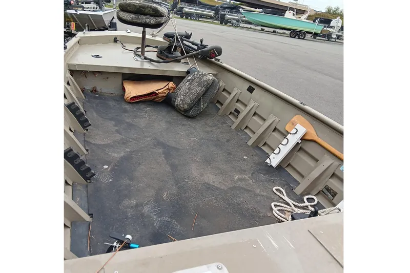 Slide: The Image of 2006 Alumacraft Crappie Jon boat interior with fishing gear and accessories. - 12