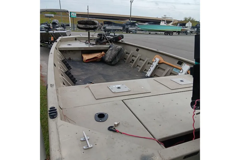 Slide: The Image of 2006 Alumacraft Crappie Jon boat, interior view, parked outdoors. - 8