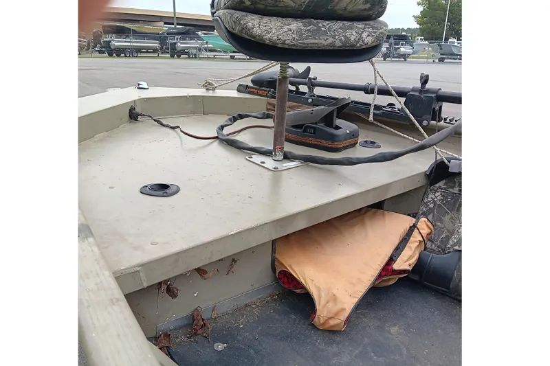 Slide: The Image of 2006 Alumacraft Crappie Jon boat interior with seat and storage area. - 9