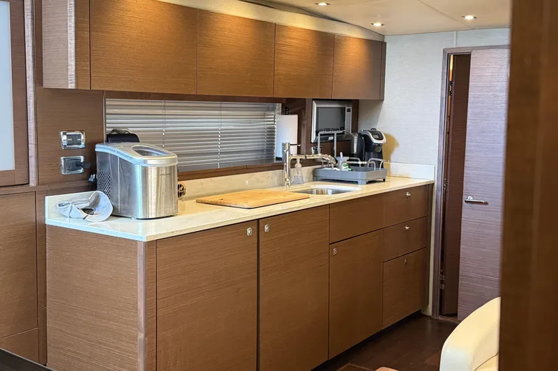Slide: The Image of Luxurious kitchen interior of 2014 Sea Ray 540 Sundancer yacht with modern appliances. - 13