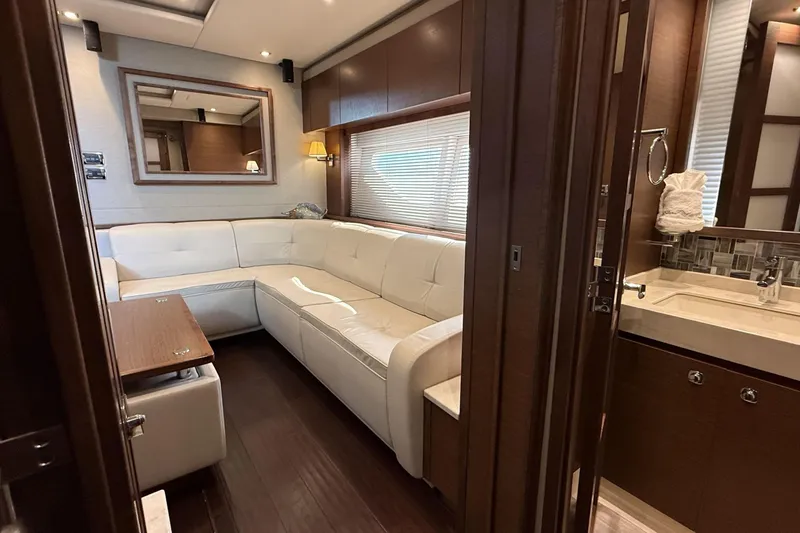 Slide: The Image of Luxurious interior of 2014 Sea Ray 540 Sundancer yacht with white leather seating. - 14