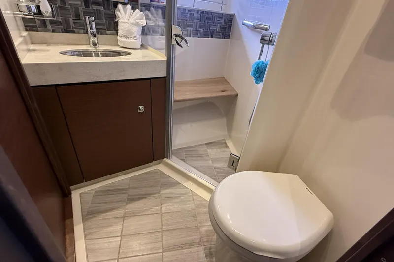 Slide: The Image of Luxurious bathroom in 2014 Sea Ray 540 Sundancer yacht with modern fixtures and shower. - 15