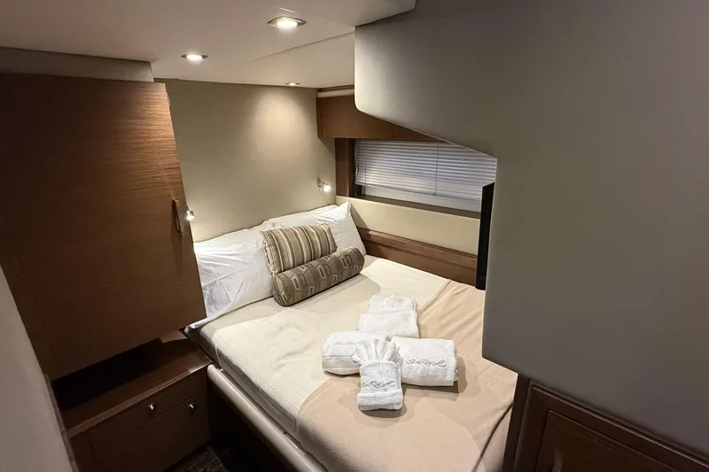 Slide: The Image of Luxurious cabin interior of 2014 Sea Ray 540 Sundancer yacht with cozy bed and elegant decor. - 18