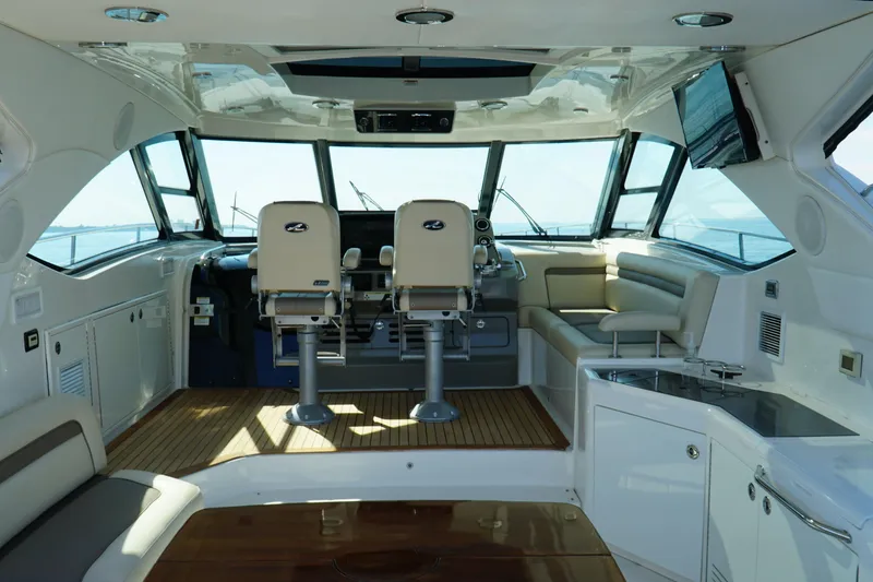 Slide: The Image of Luxurious interior of 2014 Sea Ray 540 Sundancer yacht with helm and seating area. - 5