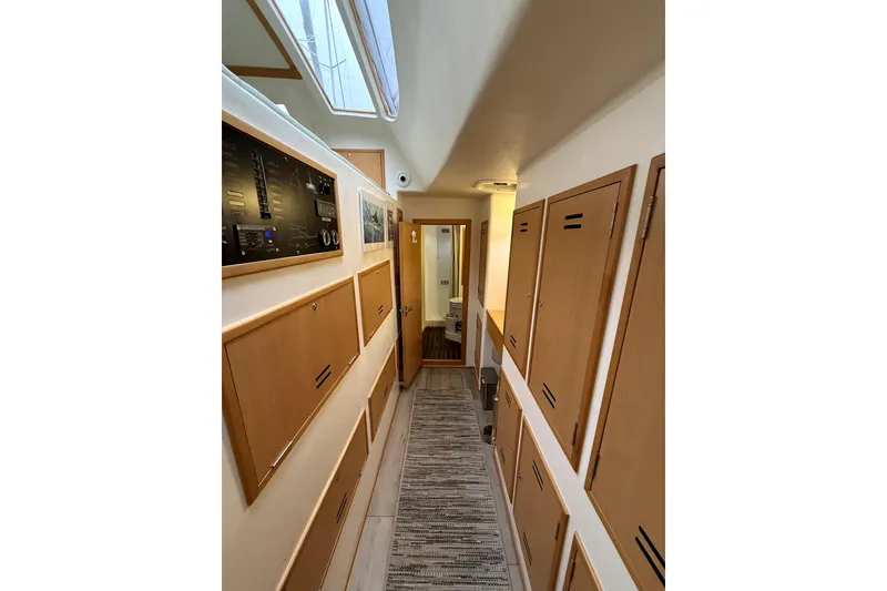 Slide: The Image of Interior of 2021 Celtic Yachts 40, featuring wooden cabinetry and modern design. - 10