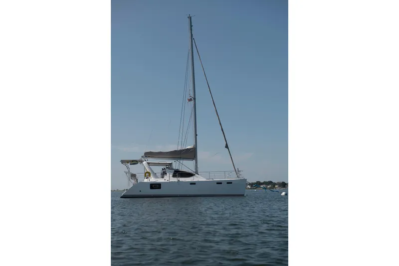 Slide: The Image of 2021 Celtic Yachts 40 sailboat on calm water under clear blue sky. - 3