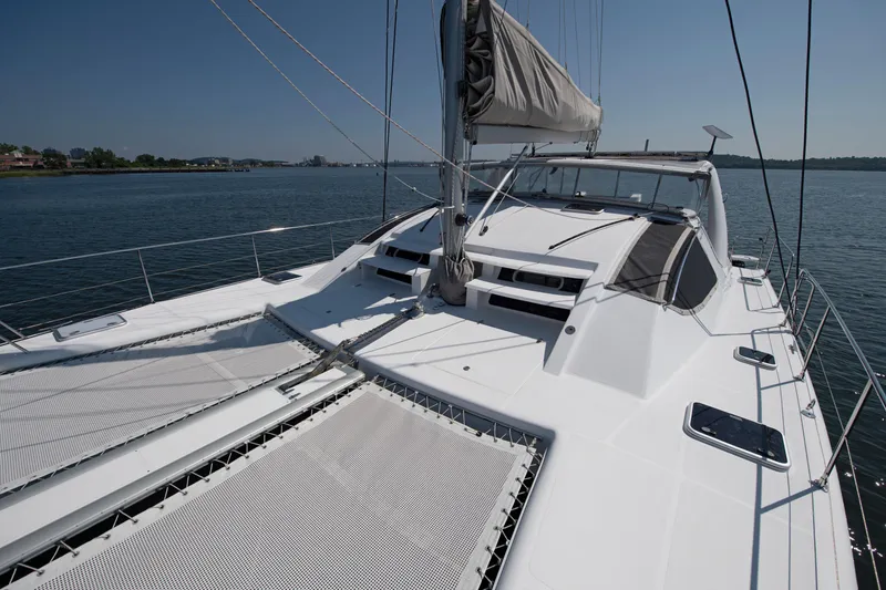 Slide: The Image of 2021 Celtic Yachts 40 catamaran on calm water, showcasing sleek design and spacious deck. - 34