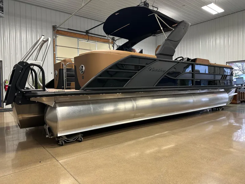 Slide: The Image of 2025 Bentley Pontoons Elite 253 Admiral in showroom, featuring sleek design and modern amenities. - 12