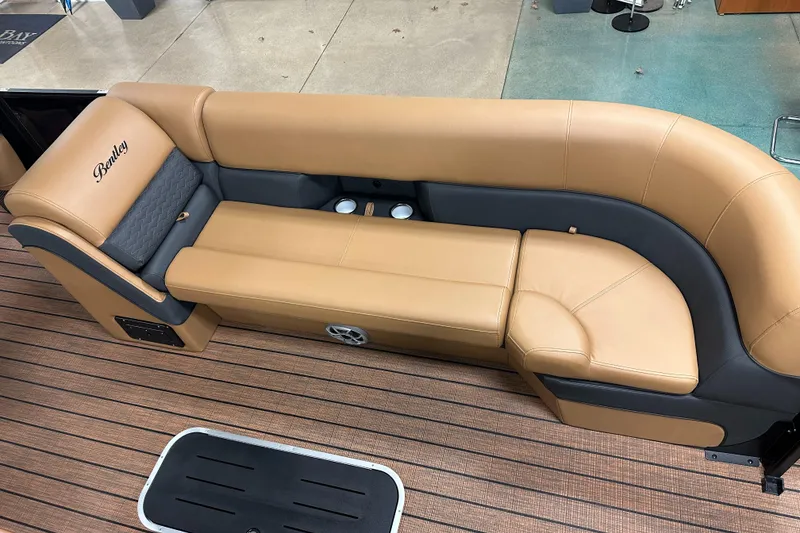 Slide: The Image of Luxurious tan seating on 2025 Bentley Pontoons Elite 253 Admiral boat. - 18