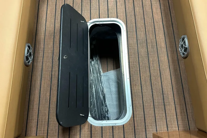 Slide: The Image of 2025 Bentley Pontoons Elite 253 Admiral floor storage compartment with open hatch. - 20
