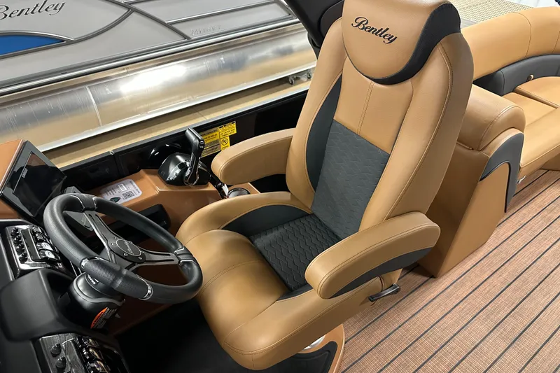 Slide: The Image of Luxurious interior of 2025 Bentley Pontoons Elite 253 Admiral with plush captain's chair. - 24