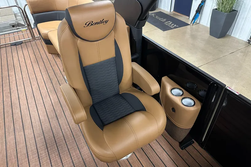 Slide: The Image of Luxurious seating in 2025 Bentley Pontoons Elite 253 Admiral with tan and black upholstery. - 26