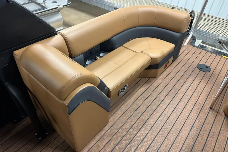 Slide: The Image of 2025 Bentley Pontoons Elite 253 Admiral with luxurious tan seating on a wooden deck. - 32