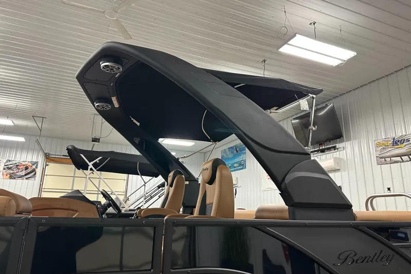 Slide: The Image of 2025 Bentley Pontoons Elite 253 Admiral in showroom, featuring sleek design and modern amenities. - 34