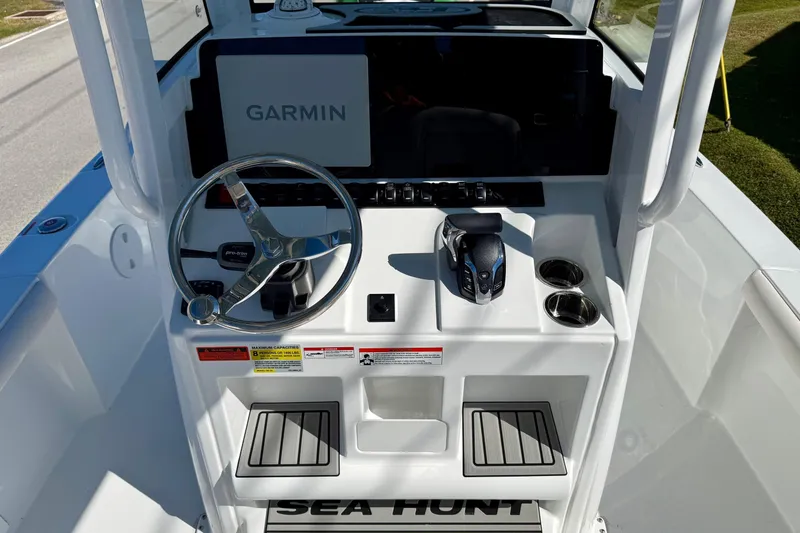 Slide: The Image of 2026 Sea Hunt BX 25 FS boat console with Garmin display and steering wheel. - 11