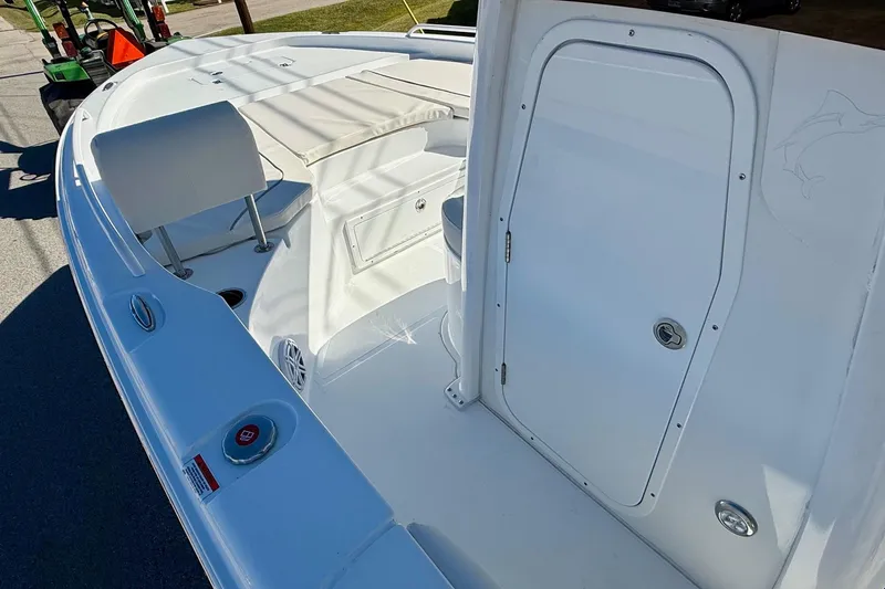 Slide: The Image of 2026 Sea Hunt BX 25 FS boat interior, featuring seating and storage compartments. - 13