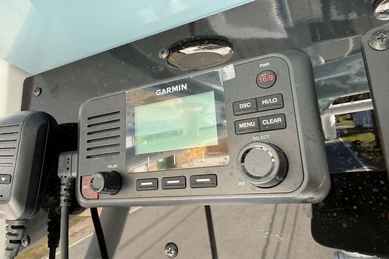 Slide: The Image of Garmin marine radio on 2026 Sea Hunt BX 25 FS boat dashboard. - 21