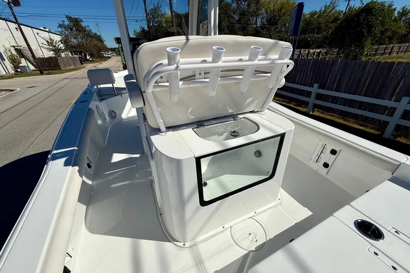 Slide: The Image of 2026 Sea Hunt BX 25 FS boat interior with rod holders and storage compartment. - 9