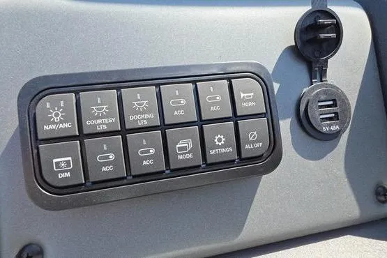 Slide: The Image of Control panel of 2026 Sun Tracker PB 20 DLX with various switches and USB ports. - 16