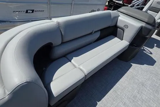 Slide: The Image of 2026 Sun Tracker PB 20 DLX boat with gray cushioned seating and spacious deck. - 6