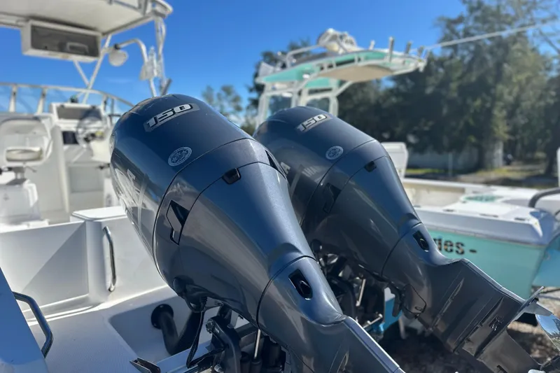 Slide: The Image of Twin 150 horsepower engines on a 2000 Cobia 240 Walkaround boat. - 17