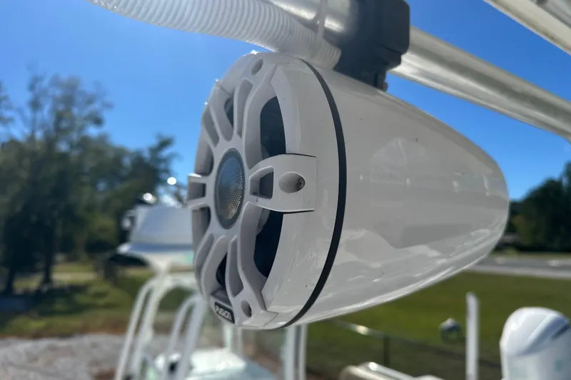 Slide: The Image of Close-up of a Fusion marine speaker on a 2000 Cobia 240 Walkaround boat. - 7