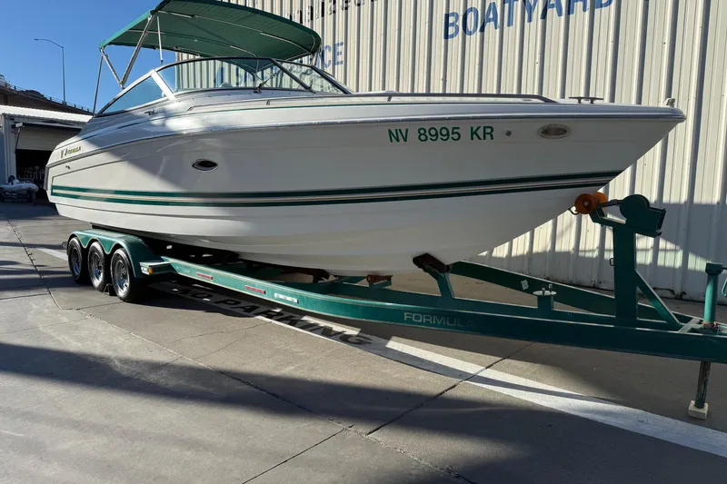 Slide: The Image of 2000 Formula 280 Sun Sport boat on trailer, parked at a boatyard. - 1
