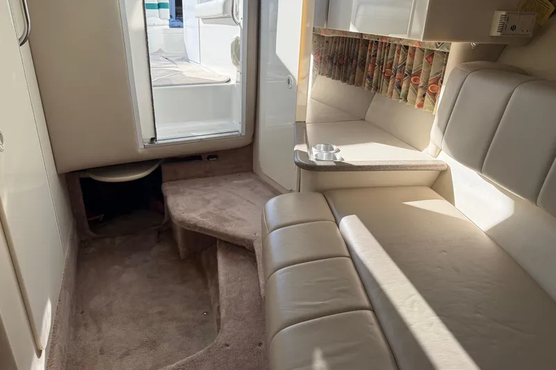 Slide: The Image of Interior of 2000 Formula 280 Sun Sport boat with beige seating and carpet. - 10