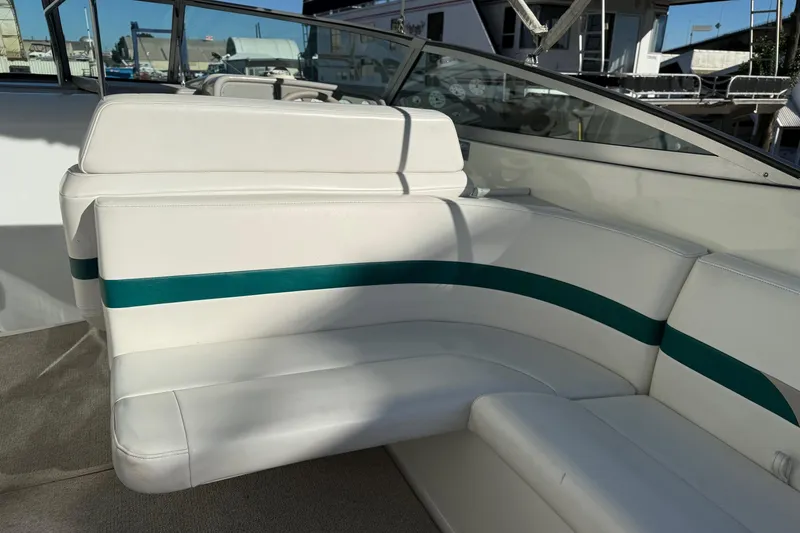 Slide: The Image of Interior of a 2000 Formula 280 Sun Sport boat with white and teal seating. - 14