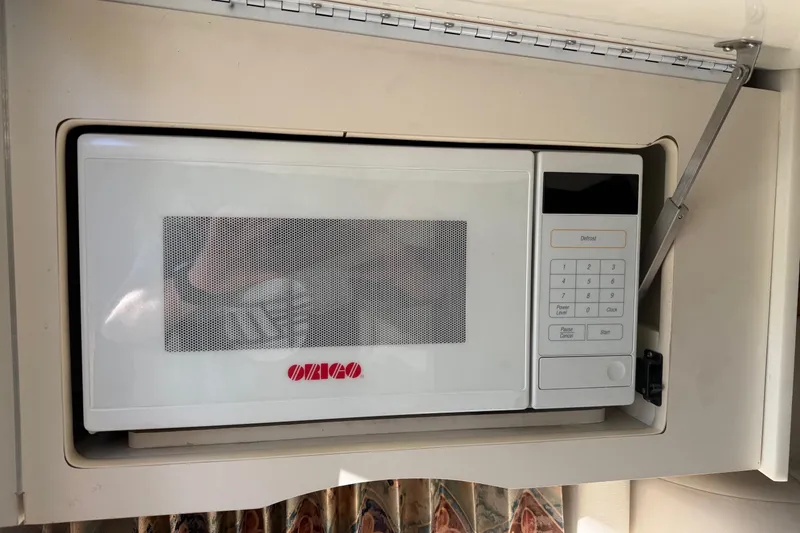 Slide: The Image of Built-in microwave in a 2000 Formula 280 Sun Sport boat interior. - 19
