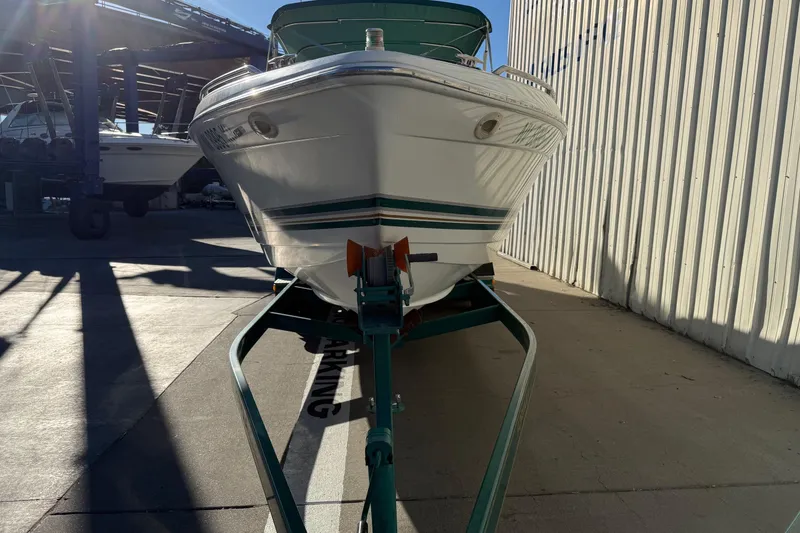 Slide: The Image of 2000 Formula 280 Sun Sport boat on trailer in marina, side view. - 2