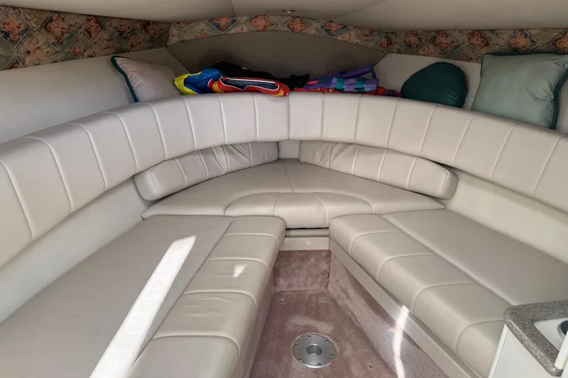 Slide: The Image of Interior of a 2000 Formula 280 Sun Sport boat with cushioned seating. - 9