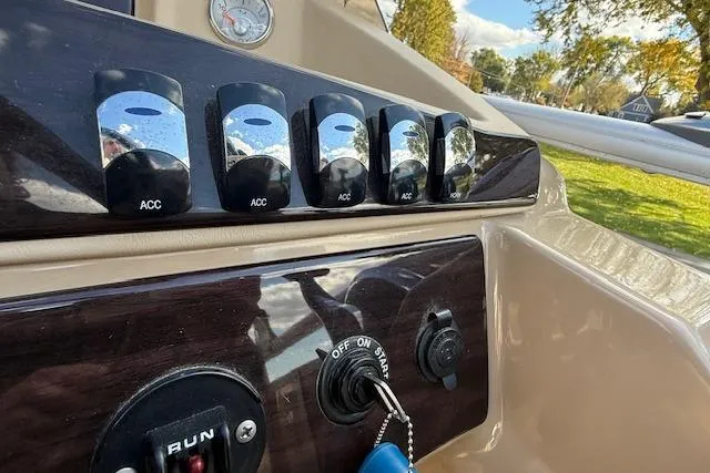 Slide: The Image of Control panel of 2014 Harris FloteBote Sunliner 200 with switches and ignition key. - 10