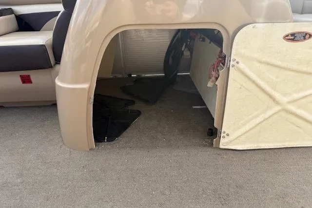 Slide: The Image of 2014 Harris FloteBote Sunliner 200 interior storage compartment with open door. - 21